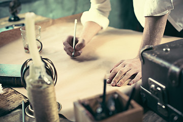 Image showing Architect working on drawing table in office