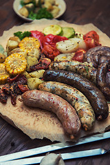 Image showing Grilled sausages with vegetables