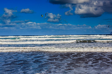 Image showing Surfers and kiters in the water on Famara beach, Lanzarote