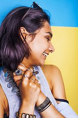 Image showing lifestyle people concept. young pretty smiling indian girl with long nails wearing lot of jewelry rings, asian summer happy cool