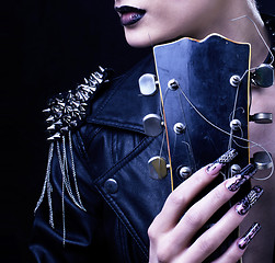 Image showing Fashion Rocker Style Model Girl Portrait. Hairstyle. Punk Woman Makeup, Hairdo and black Nails. Smoky Eyes