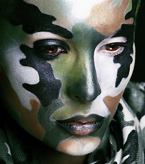 Image showing Beautiful young fashion woman with military style clothing and face paint make-up, khaki colored
