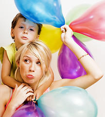 Image showing pretty real family with color balloons on white background, blon