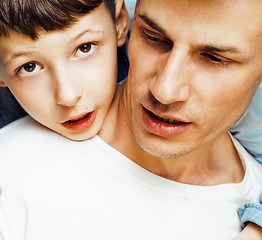 Image showing young pretty man model with little cute son playing together, lifestyle modern people concept, family male 