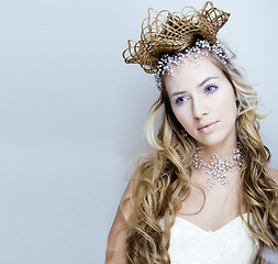 Image showing beauty young snow queen with hair crown on her head, complicate 