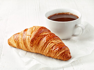 Image showing freshly baked croissant and coffee cup