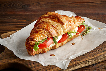 Image showing Croissant sandwich with mozzarella and tomato