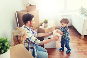 Image showing happy family moving to new home and playing ball