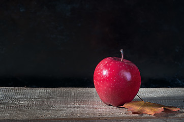 Image showing Red ripe apple on a wooden table