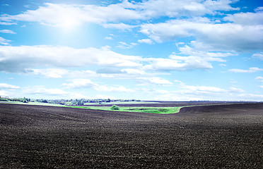 Image showing Plowed field on a bright sunny day