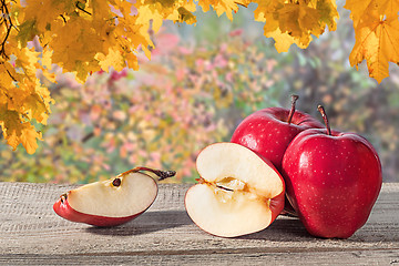 Image showing Several apples on a wooden table