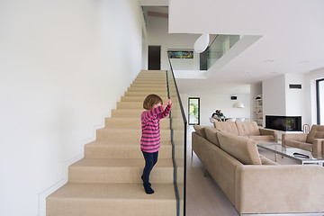 Image showing family with little girl enjoys in the modern living room