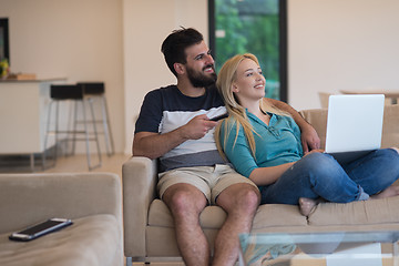 Image showing young happy couple relaxes in the living room