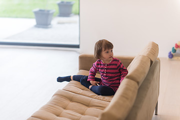 Image showing little girl playing games on smartphone