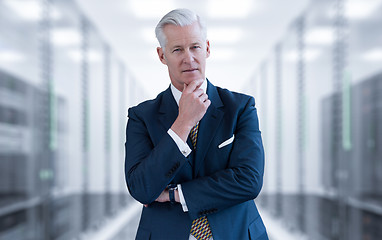 Image showing Senior businessman in server room