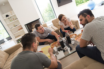 Image showing Pizza time a group of people