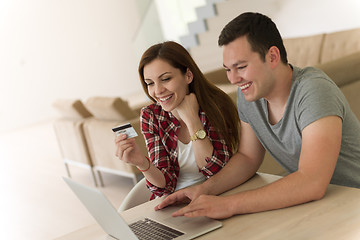 Image showing happy young couple buying online