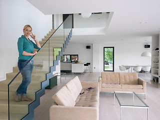 Image showing portrait of a young beautiful woman on the stairs