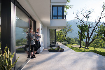 Image showing couple enjoying on the door of their luxury home villa