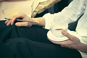 Image showing Architect working on drawing table in office