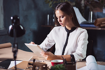 Image showing Young beautiful woman working with laptop
