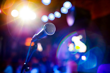 Image showing Microphone on stage against a background of auditorium.