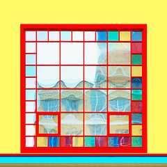 Image showing Square Red Window On A Yellow Wall