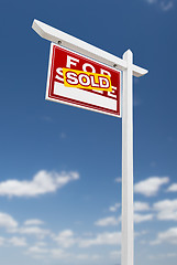 Image showing Left Facing Sold For Sale Real Estate Sign on a Blue Sky with Cl