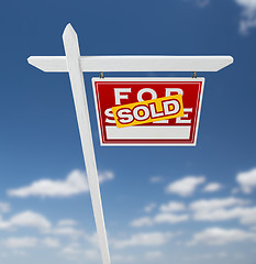 Image showing Right Facing Sold For Sale Real Estate Sign on a Blue Sky with C