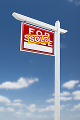 Image showing Left Facing Sold For Sale Real Estate Sign on a Blue Sky with Cl
