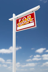 Image showing Right Facing Sold For Sale Real Estate Sign on a Blue Sky with C