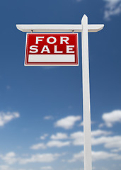 Image showing Left Facing For Sale Real Estate Sign on a Blue Sky with Clouds.
