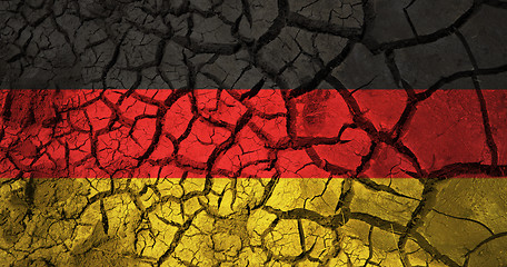 Image showing german flag on cracked ground background