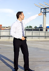 Image showing businessman in a front of a building site