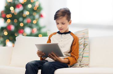 Image showing boy with tablet pc at home at christmas