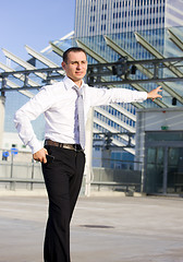 Image showing businessman in a front of a building site