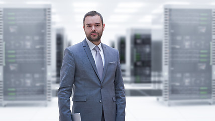 Image showing Young businessman in server room