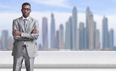 Image showing Young black businessman in front of the big city