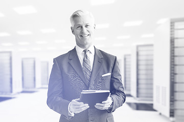 Image showing Senior businessman in server room