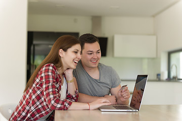 Image showing happy young couple buying online