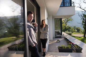 Image showing couple enjoying on the door of their luxury home villa