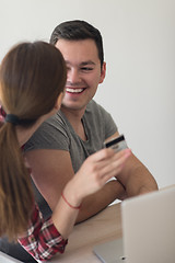 Image showing happy young couple buying online