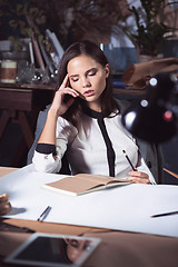 Image showing Architect working on drawing table in office