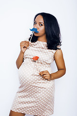 Image showing young pretty african american woman pregnant happy smiling, posing on white background isolated , lifestyle people concept