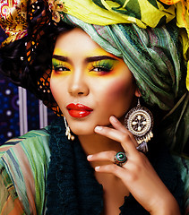 Image showing beauty bright woman with creative make up, many shawls on head like cubian, ethno 