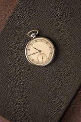 Image showing Pocket watch on dark textured background