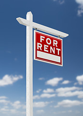 Image showing Right Facing For Rent Real Estate Sign on a Blue Sky with Clouds