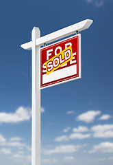 Image showing Right Facing Sold For Sale Real Estate Sign on a Blue Sky with C