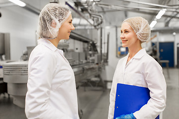 Image showing happy women technologists at ice cream factory