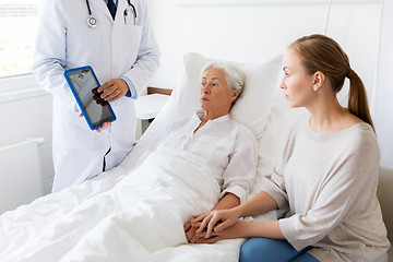 Image showing senior woman and doctor with tablet pc at hospital